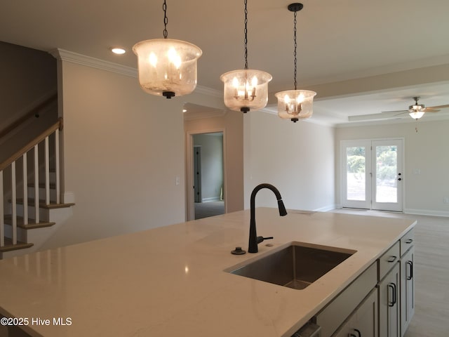 312 River Oats Ct, Holly Ridge, NC 28445 - kitchen with hanging light fixtures, ornamental molding, light stone counters, recessed lighting, and open floor plan