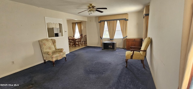 101 Oakland Blvd, Clinton, NC 28328 - living area featuring ceiling fan, baseboards, and carpet flooring