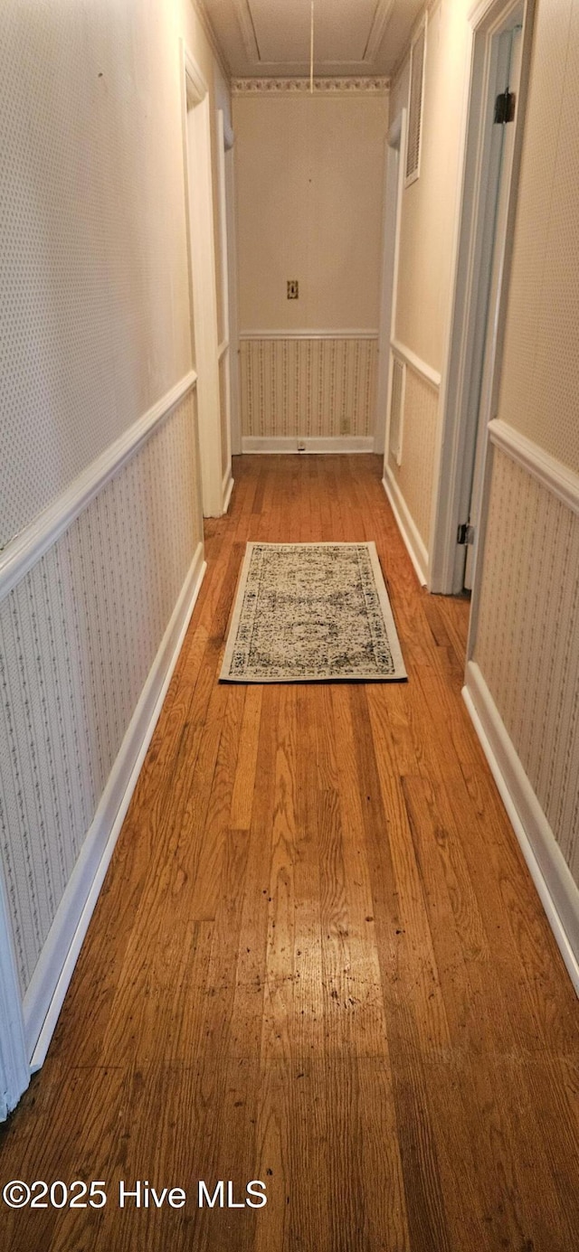 101 Oakland Blvd, Clinton, NC 28328 - hall with wood finished floors, attic access, and wallpapered walls