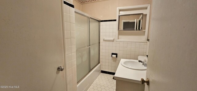101 Oakland Blvd, Clinton, NC 28328 - full bathroom with bath / shower combo with glass door, vanity, and tile walls