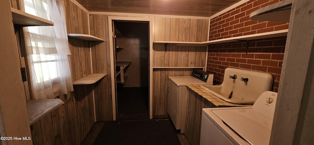 101 Oakland Blvd, Clinton, NC 28328 - clothes washing area featuring washer / clothes dryer, wooden ceiling, laundry area, and wood walls
