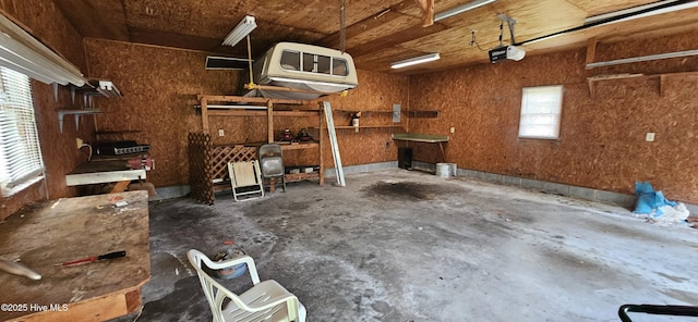 101 Oakland Blvd, Clinton, NC 28328 - garage with a garage door opener and a workshop area