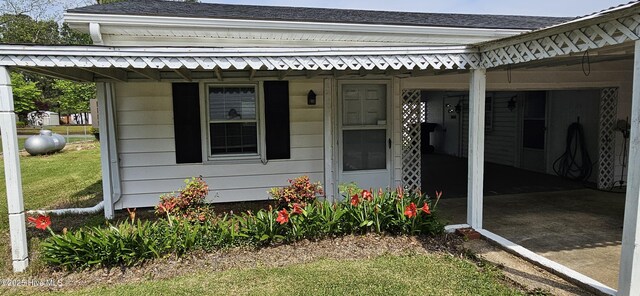 101 Oakland Blvd, Clinton, NC 28328 - property entrance with roof with shingles