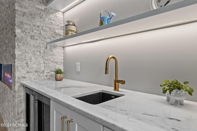 interior space featuring a sink and beverage cooler