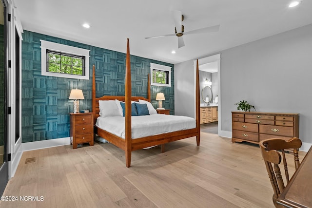 bedroom featuring multiple windows, light wood finished floors, and recessed lighting