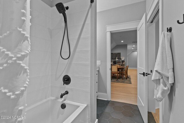 full bathroom featuring shower / bathing tub combination and tile patterned flooring