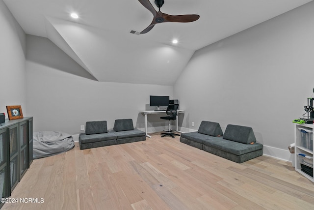 home office featuring wood finished floors, ceiling fan, baseboards, lofted ceiling, and visible vents