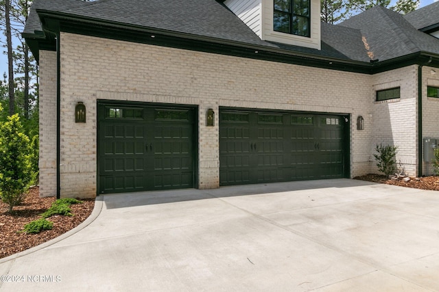 garage featuring driveway
