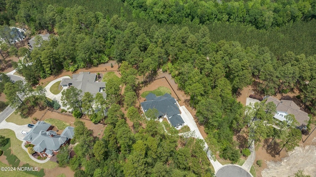 aerial view featuring a view of trees and a residential view