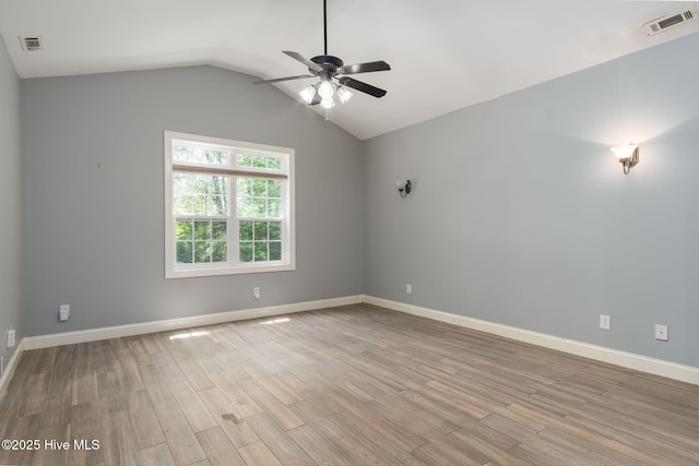 6321 Albatross Dr, New Bern, NC 28560 - spare room featuring ceiling fan, wood finished floors, lofted ceiling, and baseboards
