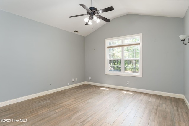 6321 Albatross Dr, New Bern, NC 28560 - empty room with a ceiling fan, vaulted ceiling, light wood finished floors, and baseboards