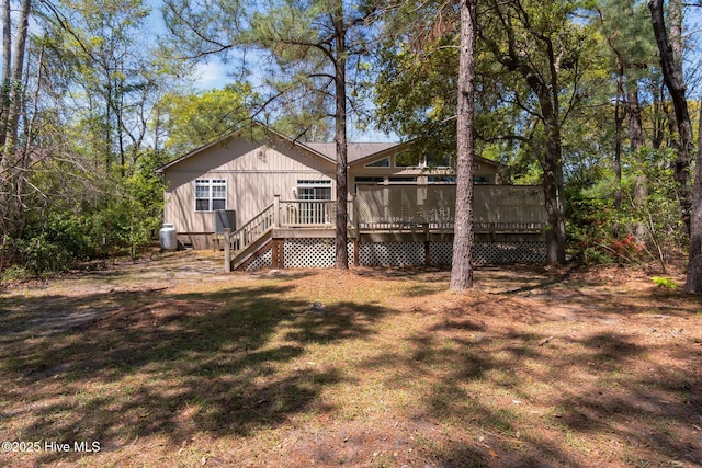6321 Albatross Dr, New Bern, NC 28560 - rear view of house featuring a wooden deck and a lawn