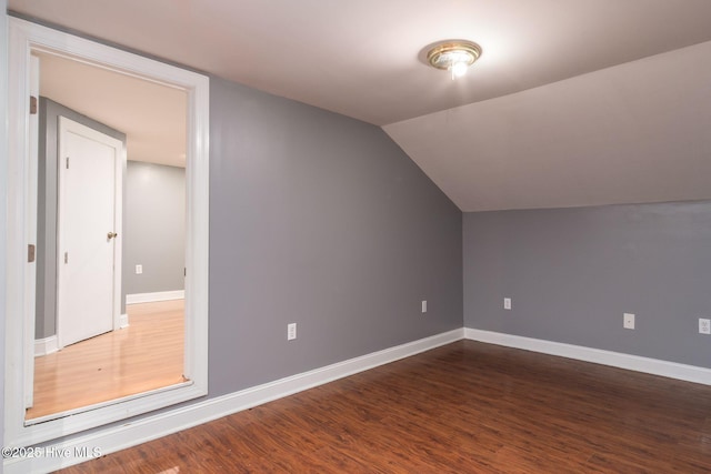 6321 Albatross Dr, New Bern, NC 28560 - bonus room featuring dark wood finished floors, baseboards, and vaulted ceiling