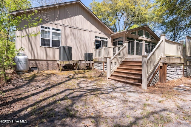 6321 Albatross Dr, New Bern, NC 28560 - rear view of house with stairway, a deck, a sunroom, and central AC unit
