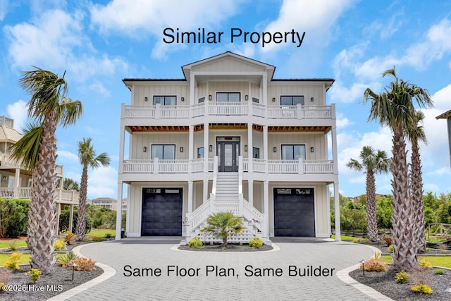 1519 New River Inlet Rd, North Topsail Beach, NC 28460 - beach home featuring board and batten siding, a balcony, decorative driveway, stairway, and a porch
