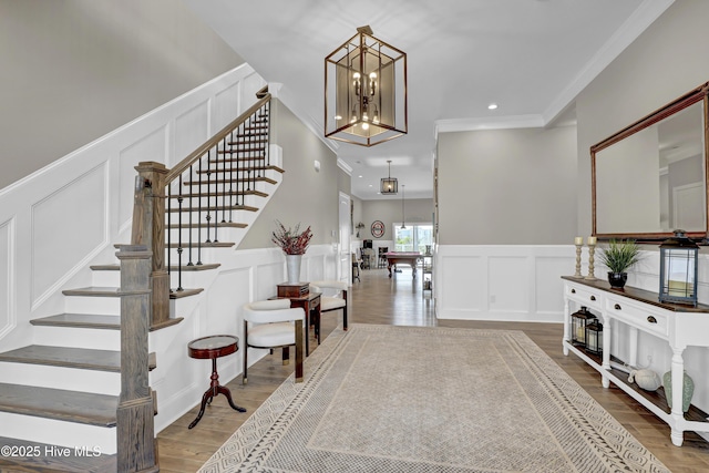 1519 New River Inlet Rd, North Topsail Beach, NC 28460 - entrance foyer featuring wood finished floors, a decorative wall, and wainscoting