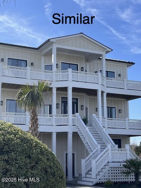 1519 New River Inlet Rd, North Topsail Beach, NC 28460 - back of property with a lawn and stairway