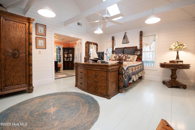 42 Brite Ln, Oriental, NC 28571 - bedroom featuring wooden walls, beamed ceiling, ceiling fan, and visible vents