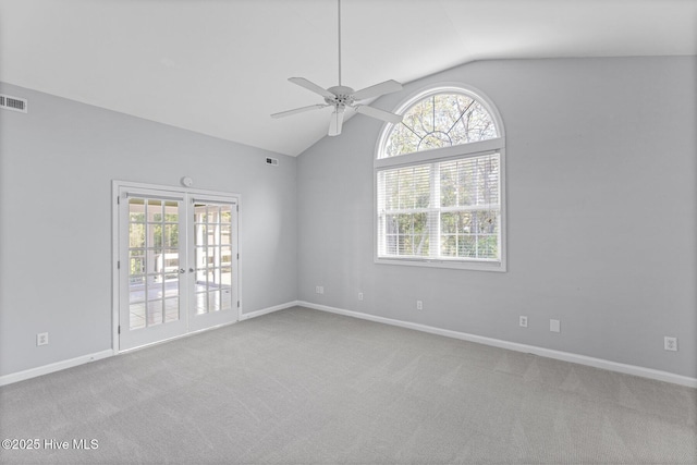 unfurnished room with carpet, baseboards, a ceiling fan, and lofted ceiling