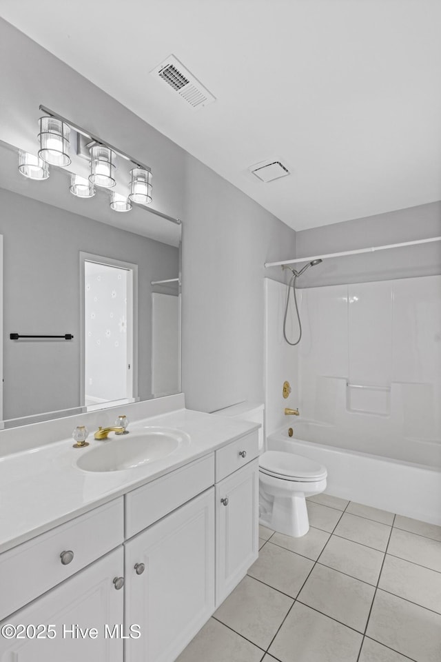 full bath featuring visible vents, washtub / shower combination, toilet, vanity, and tile patterned floors
