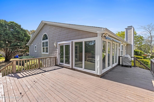 wooden deck with grilling area