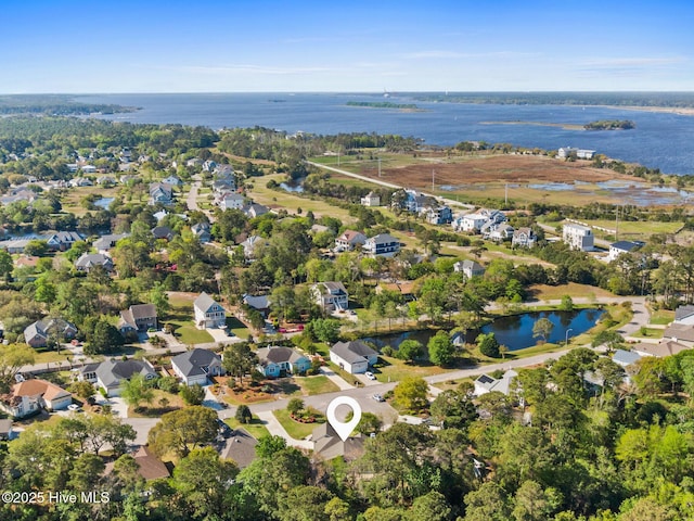 birds eye view of property with a water view and a residential view
