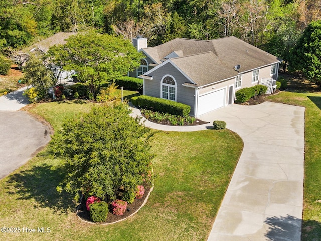 ranch-style house with a front yard, a shingled roof, a garage, a chimney, and concrete driveway