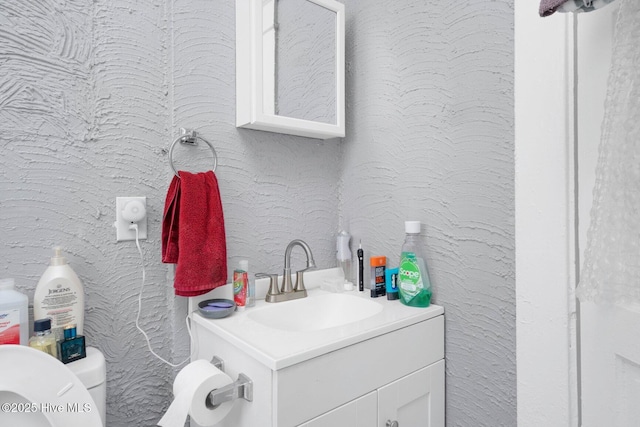 304 Ambler Ave, Rocky Mount, NC 27801 - bathroom with toilet, vanity, and a textured wall