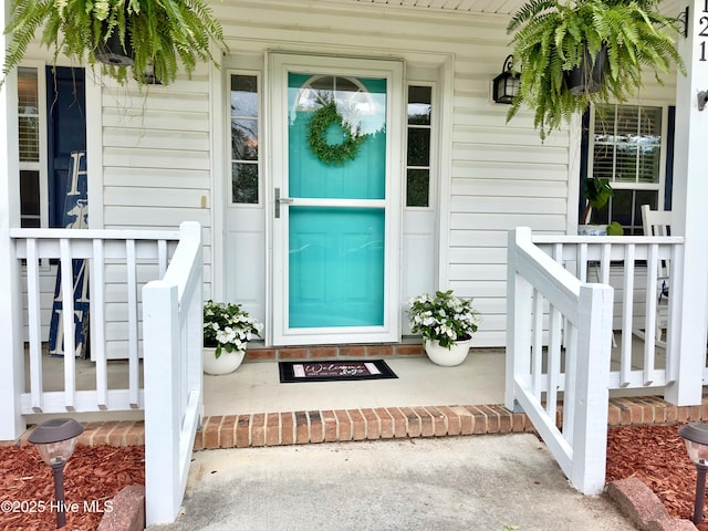 entrance to property featuring a porch