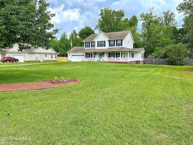 view of front facade featuring covered porch, fence, and a front lawn
