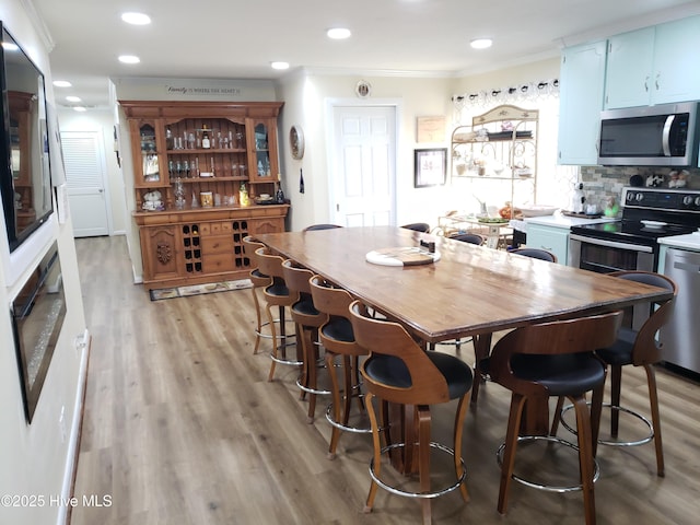 504 E S St, Fremont, NC 27830 - dining space featuring ornamental molding, light wood-type flooring, and recessed lighting