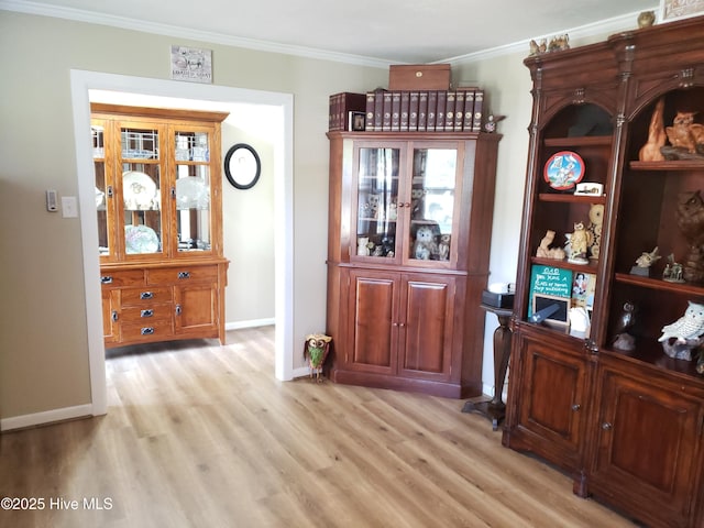 504 E S St, Fremont, NC 27830 - dining area with light wood finished floors, ornamental molding, and baseboards