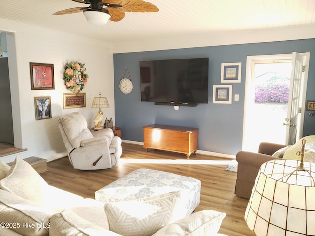504 E S St, Fremont, NC 27830 - living room with wood finished floors, ceiling fan, and baseboards