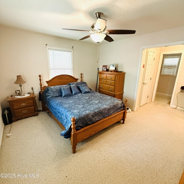 501 Blackfoot Trl, Edenton, NC 27932 - bedroom with light colored carpet and a ceiling fan