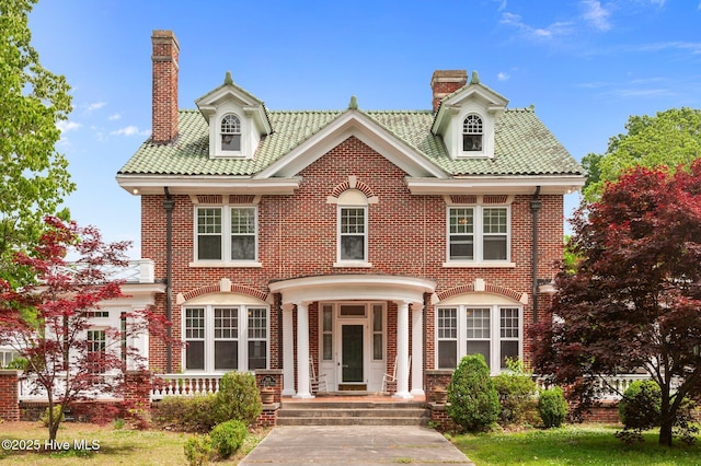 306 N Parker St, Elm City, NC 27822 - colonial home featuring a chimney and brick siding