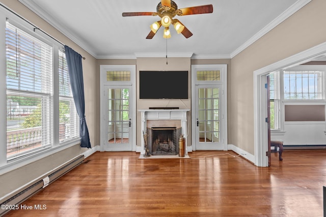 306 N Parker St, Elm City, NC 27822 - unfurnished living room featuring a baseboard radiator, crown molding, wood finished floors, a fireplace with flush hearth, and ceiling fan