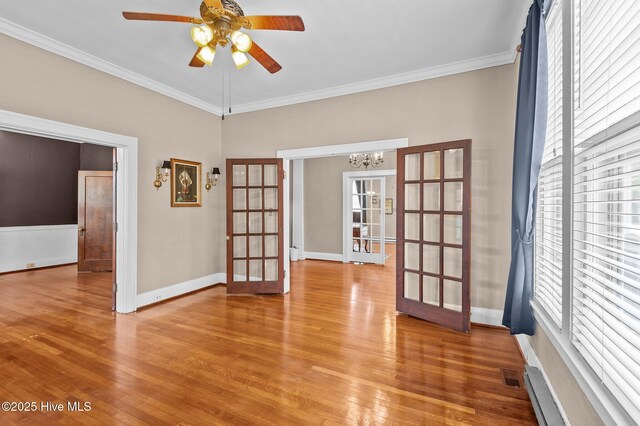306 N Parker St, Elm City, NC 27822 - spare room with light wood-type flooring, french doors, and ornamental molding