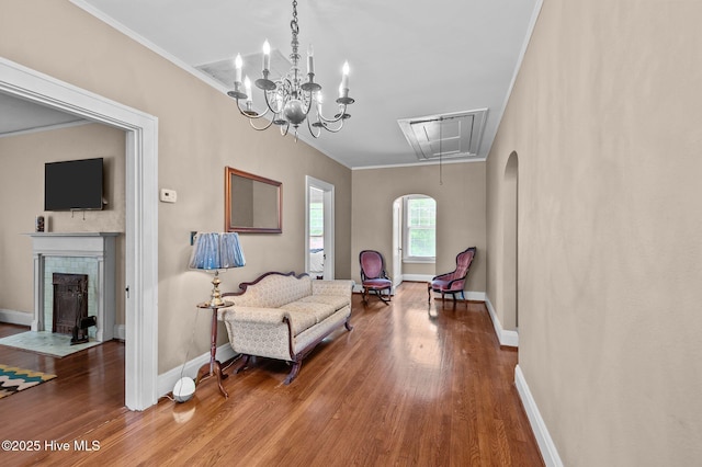 306 N Parker St, Elm City, NC 27822 - sitting room with attic access, wood finished floors, baseboards, and ornamental molding