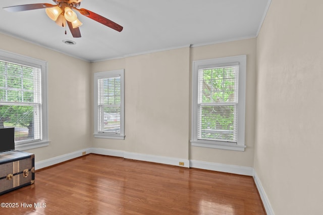 306 N Parker St, Elm City, NC 27822 - unfurnished room featuring plenty of natural light, ornamental molding, and wood finished floors