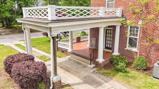 306 N Parker St, Elm City, NC 27822 - exterior space featuring central AC, brick siding, a balcony, and covered porch