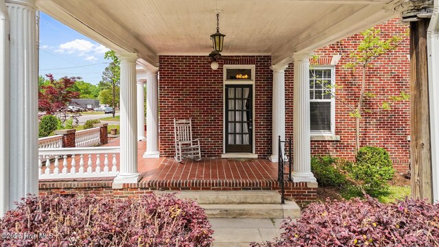 306 N Parker St, Elm City, NC 27822 - entrance to property with a porch and brick siding