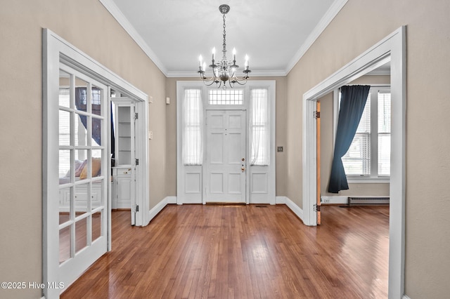 306 N Parker St, Elm City, NC 27822 - entrance foyer with hardwood / wood-style flooring, ornamental molding, and an inviting chandelier