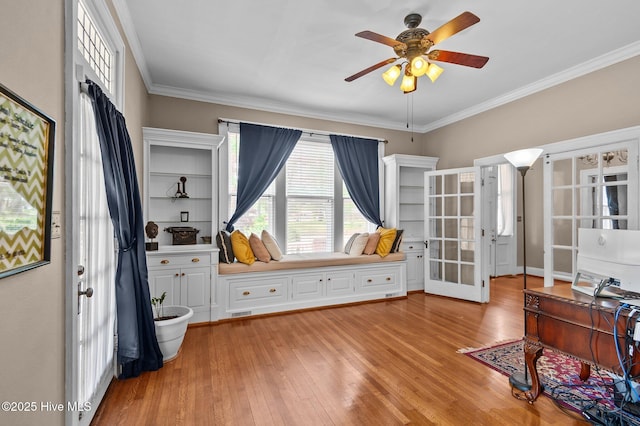 306 N Parker St, Elm City, NC 27822 - interior space with ceiling fan, french doors, ornamental molding, and light wood-style flooring