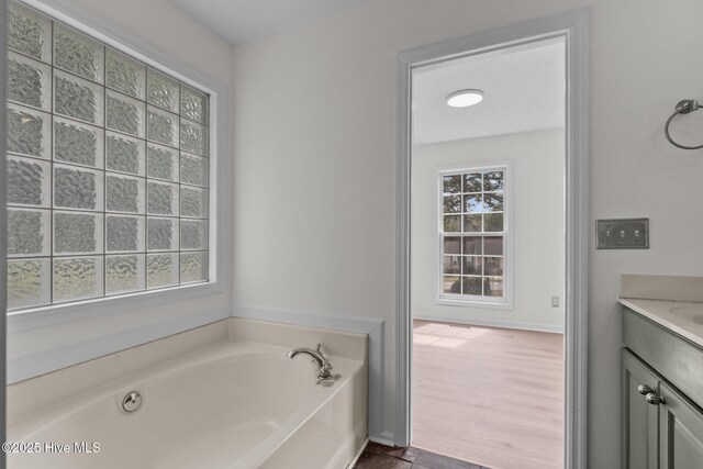 155 Patricia Ct, Whispering Pines, NC 28327 - bathroom featuring a bath and vanity