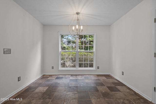155 Patricia Ct, Whispering Pines, NC 28327 - empty room with stone tile floors, a chandelier, and baseboards