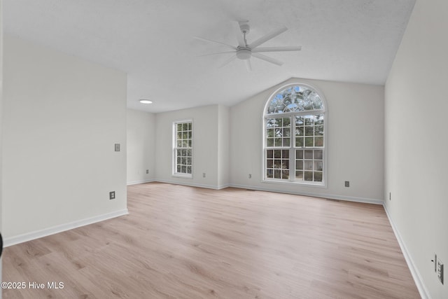 155 Patricia Ct, Whispering Pines, NC 28327 - empty room with ceiling fan, light wood finished floors, vaulted ceiling, and baseboards