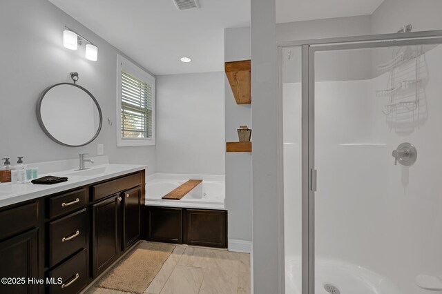 bathroom featuring visible vents, vanity, marble finish floor, a whirlpool tub, and a stall shower