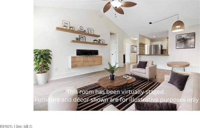 711 Glenarthur Dr, Wilmington, NC 28412 - living room featuring wood finished floors, ceiling fan, vaulted ceiling, and baseboards