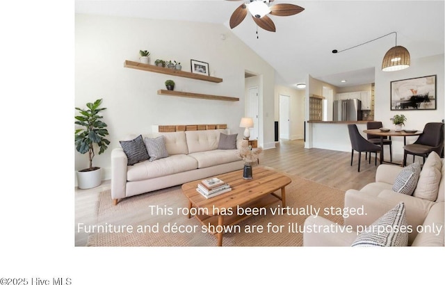 711 Glenarthur Dr, Wilmington, NC 28412 - living room featuring light wood finished floors, ceiling fan, vaulted ceiling, and baseboards