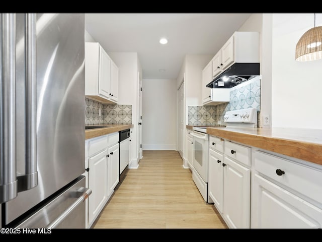 711 Glenarthur Dr, Wilmington, NC 28412 - kitchen with freestanding refrigerator, white range with electric cooktop, white cabinetry, light wood-style floors, and decorative backsplash